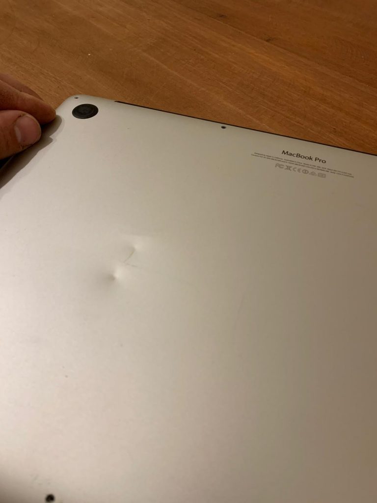 Dented MacBook lid